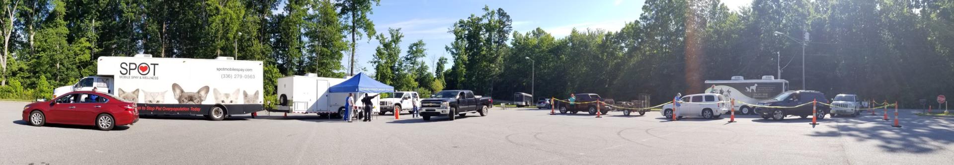 Cars pulled up to the drive through rabies clinic.