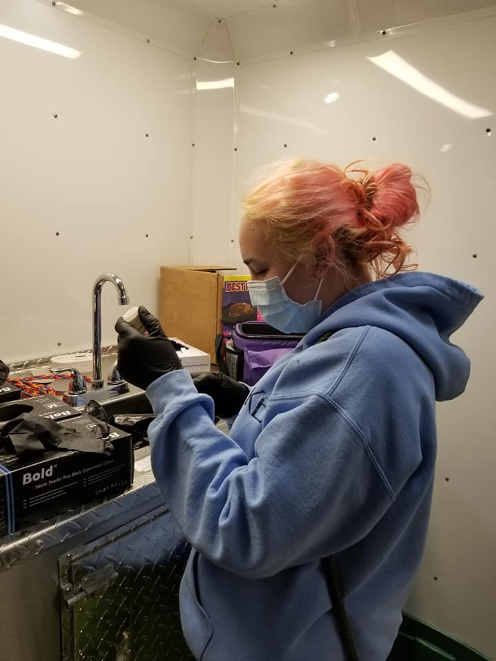 Vet tech drawing up a vaccine.