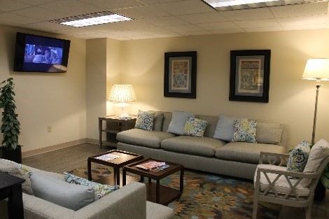 Waiting room with couches and TV