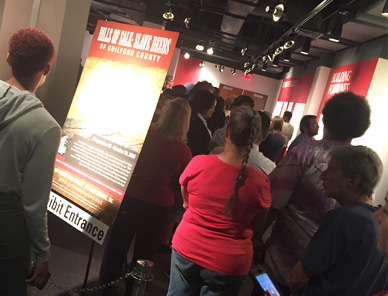 visitors at slave deeds exhibit