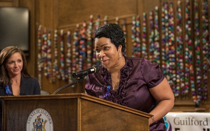 Woman speaking at podium