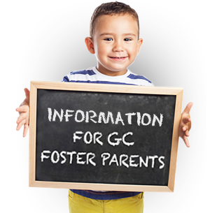 Boy holding sign that says, "Information for GC foster parents"