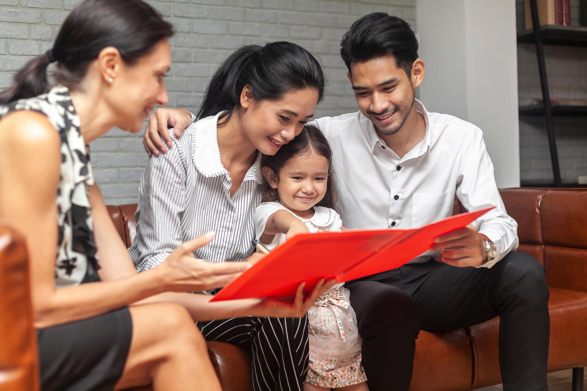 family seated together with child