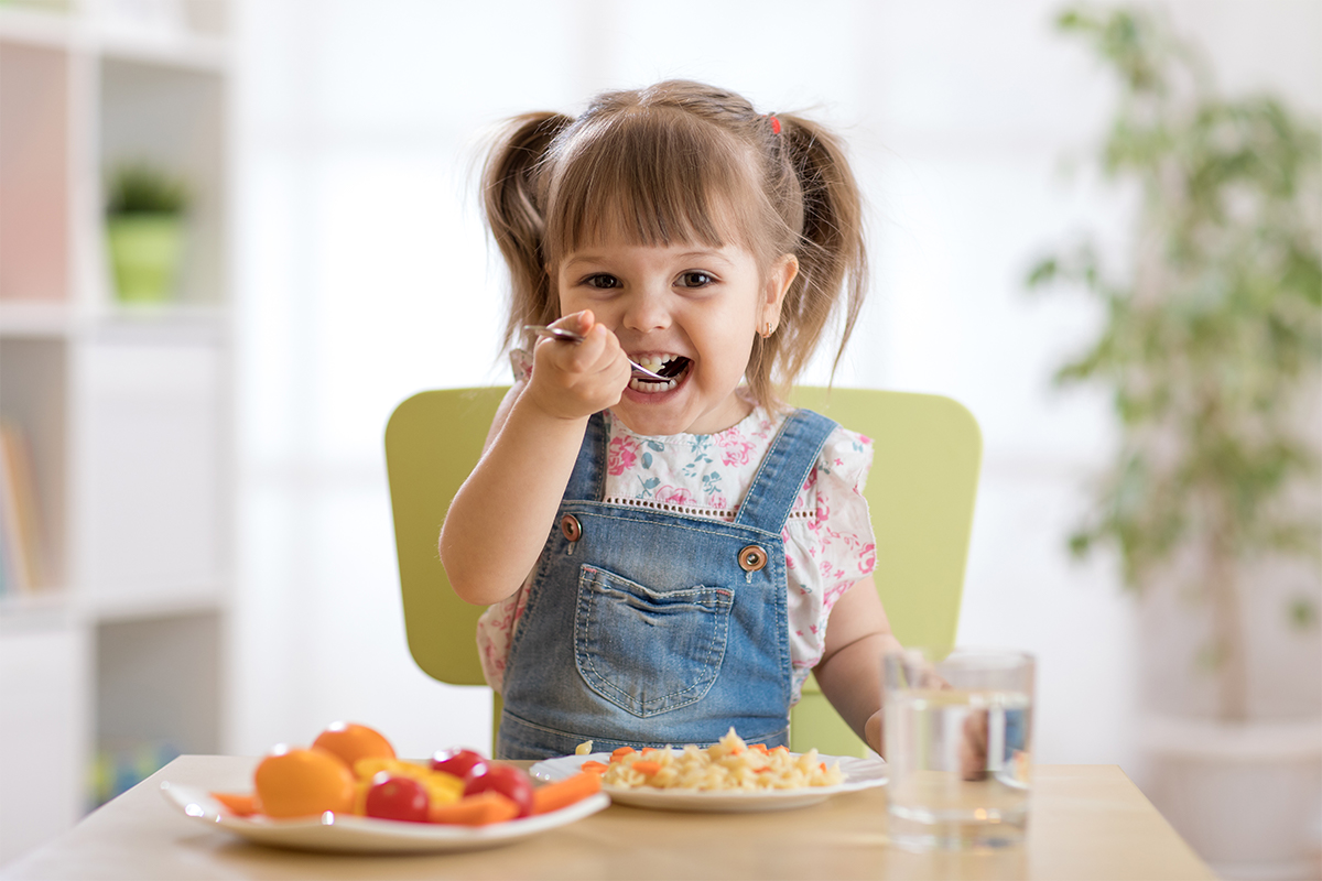 young girl eating healthy snack