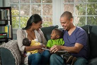 family seated with baby and small child